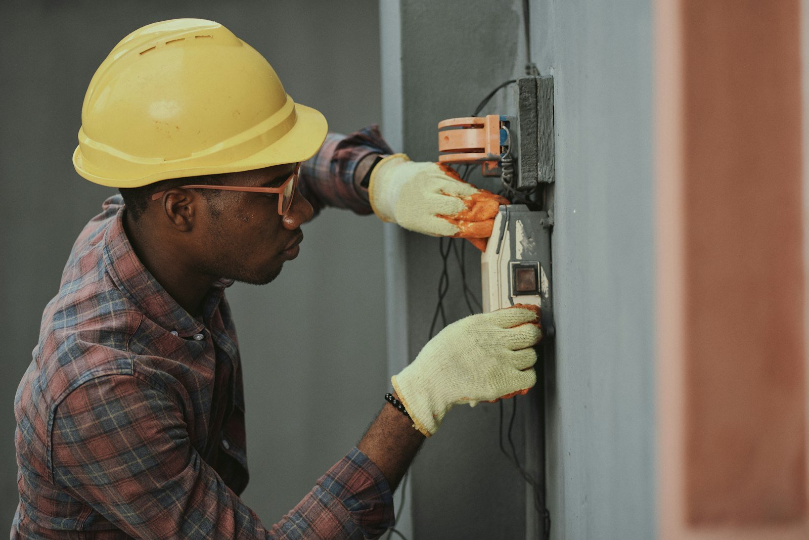 Technician wiring a home electrical panel