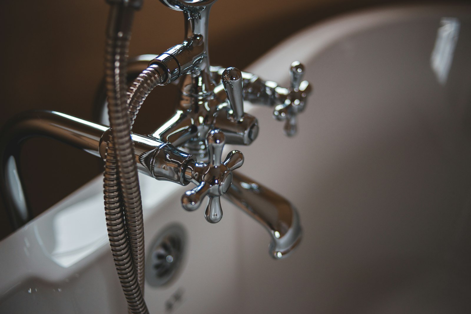 JP Capital Services technician repairing a household pipe